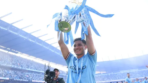 MANCHESTER, ENGLAD – MAY 21: Julian Alvarez of Manchester City celebrates with the Premier League trophy following the Premier League match between Manchester City and Chelsea FC at Etihad Stadium on May 21, 2023 in Manchester, England. (Photo by Michael Regan/Getty Images)