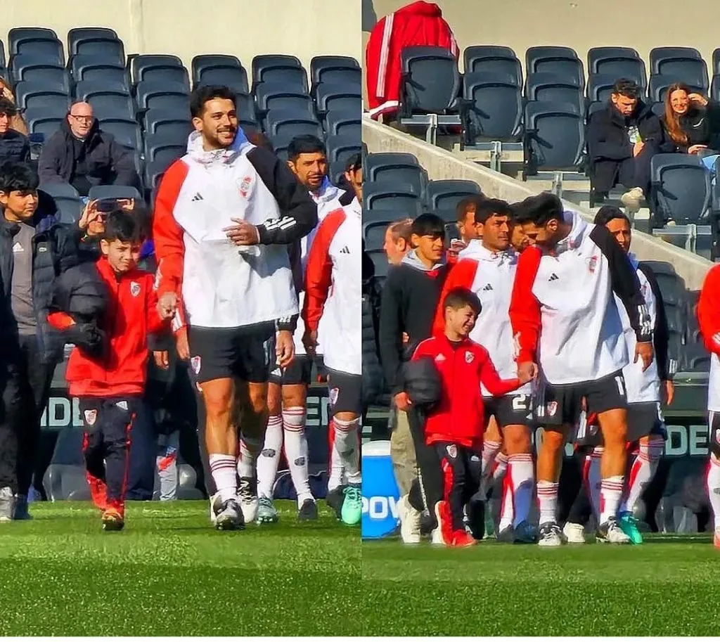 Olivero saliendo al césped del Monumental junto a su sobrino antes de la final con Tigre disputada en 2024.